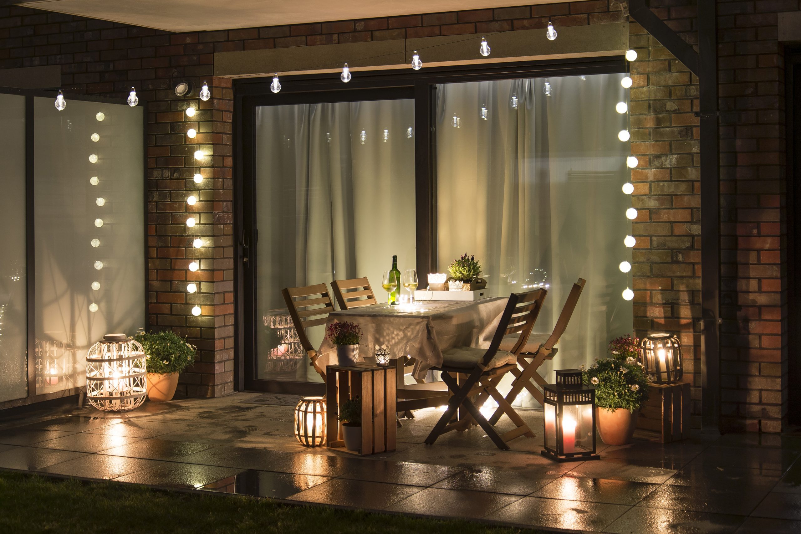 https://www.houselogic.com/wp-content/uploads/2022/06/Outdoor-patio-light-ideas-night-string-lighting-lanterns.jpg
